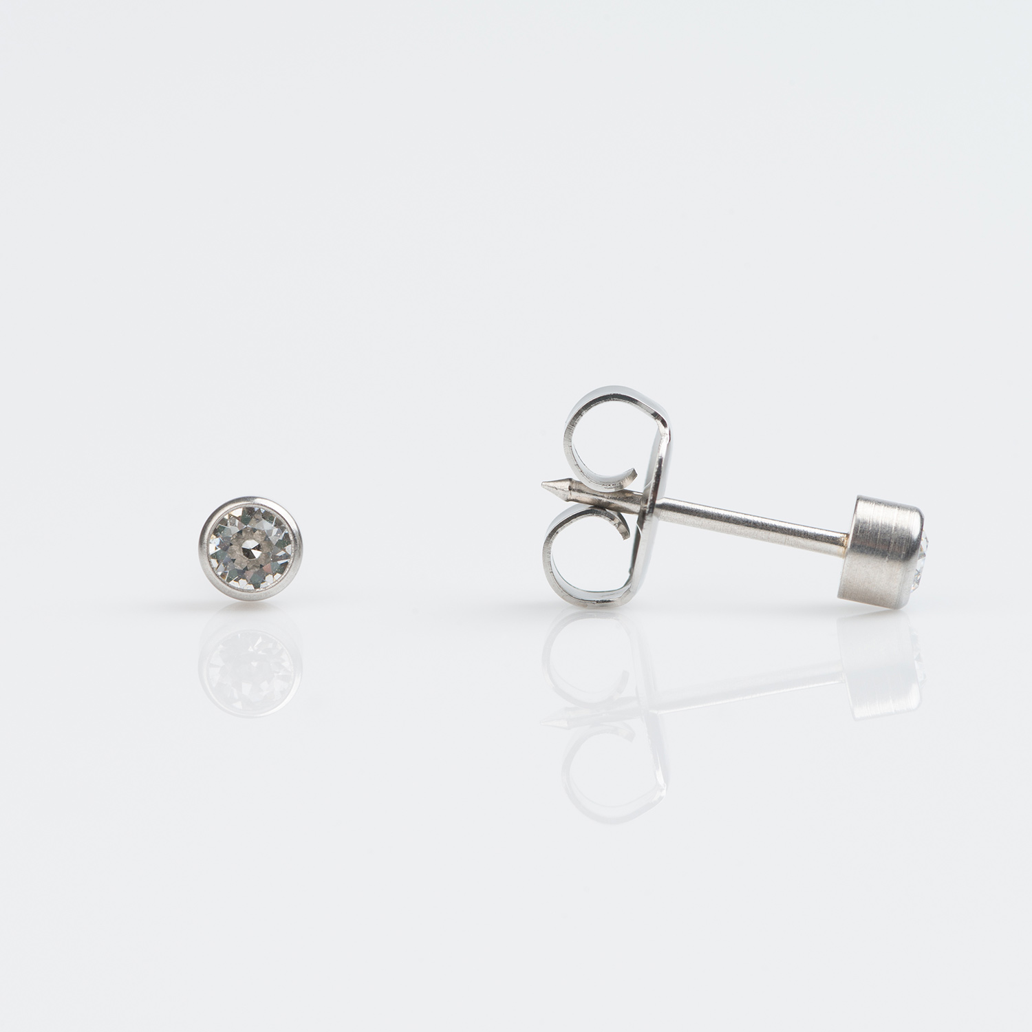 7509-5204 – Studex White Gold Bezel 3mm April Crystal Piercing Earrings