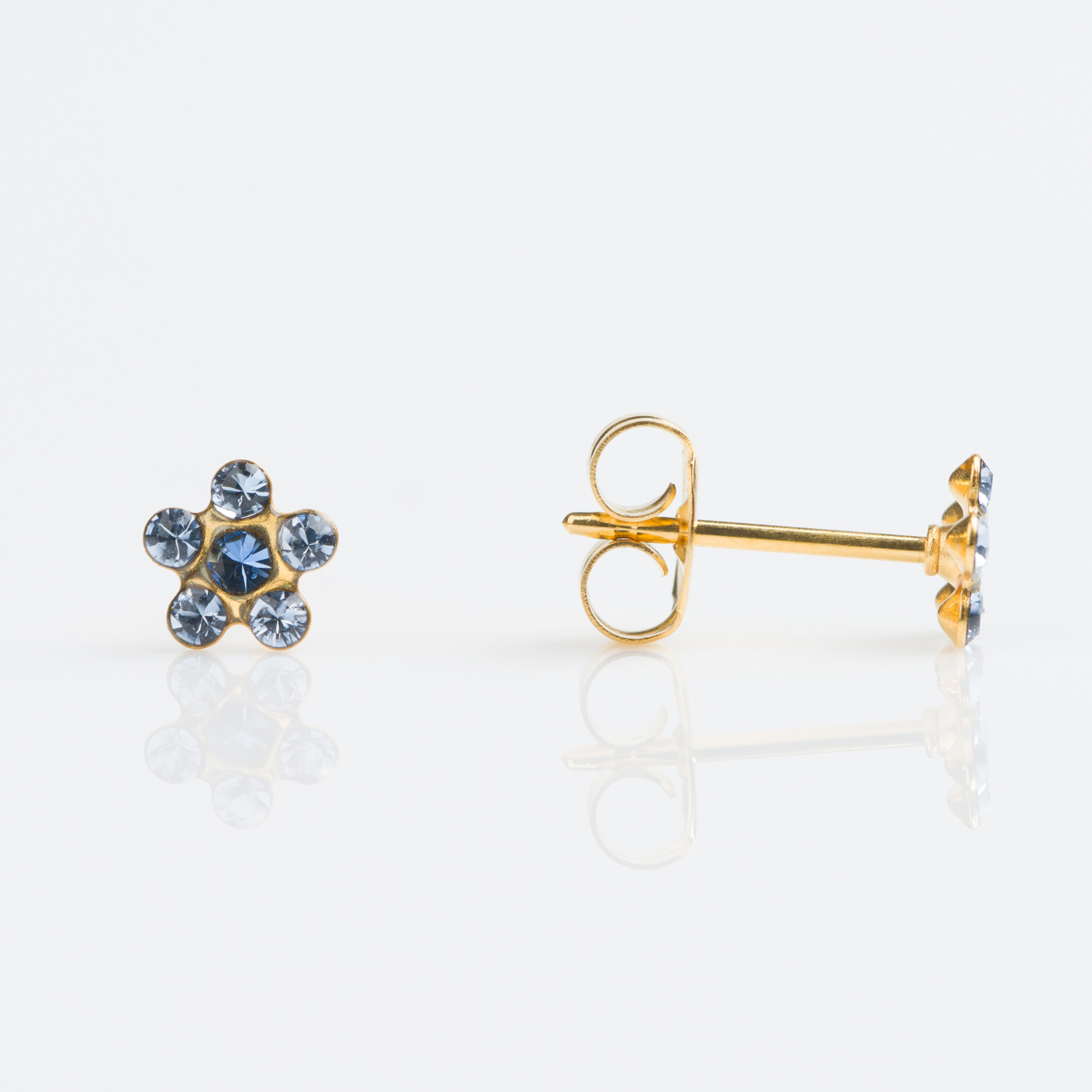 TT-6399 – Studex Tiny Tips Gold Plated Daisy Light Sapphire September Sapphire Stud Earrings
